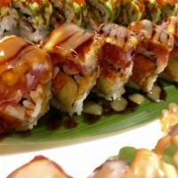 King Tuna Roll · Raw. Crunch spicy tuna and avocado wrapped inside out with seared tuna and chef's special sa...