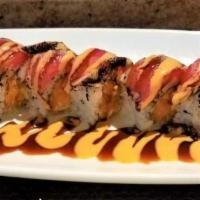 U. F. O Roll · Cooked crunch spicy white fish and avocado wrapped inside out with seared pepper tuna and ch...