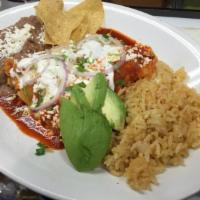 Enchiladas · Three enchiladas topped with sour cream, onions, cilantro, mozzarella and queso fresco serve...