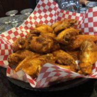 50 Pieces Tossed Wings  · Baked then deep fried and tossed in your choice of any specialty sauce or get them naked. 1 ...