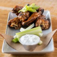 Smoked & Grilled Chicken Wings · Honey Adobo Sauce, Celery Sticks & Housemade Blue Cheese Dressing
