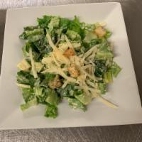Cesare · Mixed greens tossed in house-made Caesar dressing with seasoned croutons and shaved parmigiano