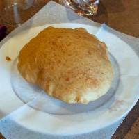 Batura · Thick deep-fried puffed bread.