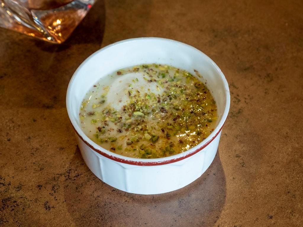 Rasmalai (3pcs) · Homemade cottage cheese patties in milk flavored with cardamom and garnished with pistachios.