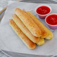 Garlic Stix with Sauce · 6 fresh stix, seasoned with our homemade garlic butter, baked in our brick oven and served w...