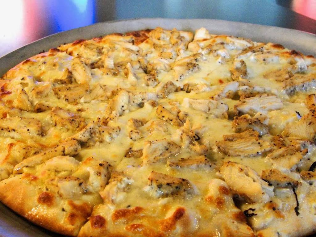 Chicken Parmigiana Pizza · Breaded chicken cutlet, marinara, and mozzarella cheese.