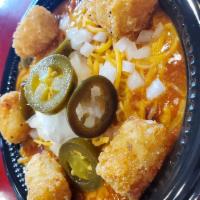 Lucky's Chili Bowl · Topped with cheddar cheese, diced onions, sour cream, jalapeño, and tater-tot croutons.