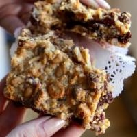 Hello Dolly Bar · Made with graham crackers, chocolate chips, butterscotch chips, coconut, and chopped pecans.