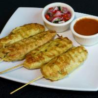 11. Chicken Satay · Grilled marinated chicken in coconut milk and curry powder. Served with peanut sauce and cuc...