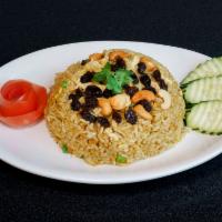 60. Pineapple Fried Rice · Stir fried jasmine rice, with egg, pineapple, onion, carrots, peas, cashew, raisins, curry p...