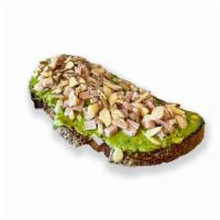 Avocado Turkey Toast · Avocado mash, turkey, sliced almonds, maple syrup drizzle, salt & pepper.