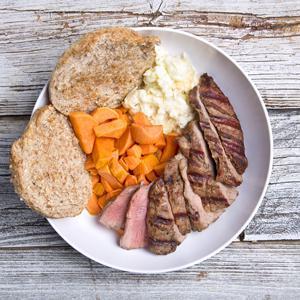 Muscle Boy · Certified Angus beef steak, grilled sweet potatoes, six egg whites served with an Ezekiel English muffin.
