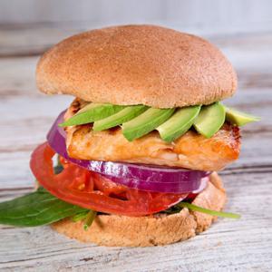 Salmon Burger · Sustainable salmon, spinach, red onions, tomatoes, avocado, with Protein House house-made agave mustard.
