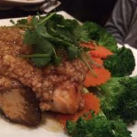 Grilled Salmon · Grilled salmon served with garlic herbs, steamed broccoli and carrots