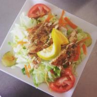 Chicken Salad · Grilled Chicken served over a bed of lettuce, tomatoes, bell Peppers & Onions topped with ch...