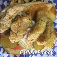 Po-boy Sandwich · Freshly fried catfish or shrimp fried to a golden crisp served with lettuce, tomato, pickle ...