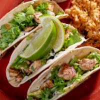 Tequila Lime Chicken Tacos · Marinated chicken, lettuce, shredded mozzarella cheese, chips, fresh avocado and lime mayo.