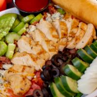 Chicken Cobb Salad · Mixed greens topped with grilled chicken, bleu cheese crumbles, smokehouse bacon, fresh avoc...