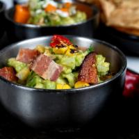 Bacon & Corn Guacamole · Hass avocado, smoked bacon, charred corn, cotija cheese, piquilllo peppers, onion, cilantro....