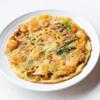 Haemul Pajeon · Korean style thin pancake w. assorted seafood, vegetables, and tofu.