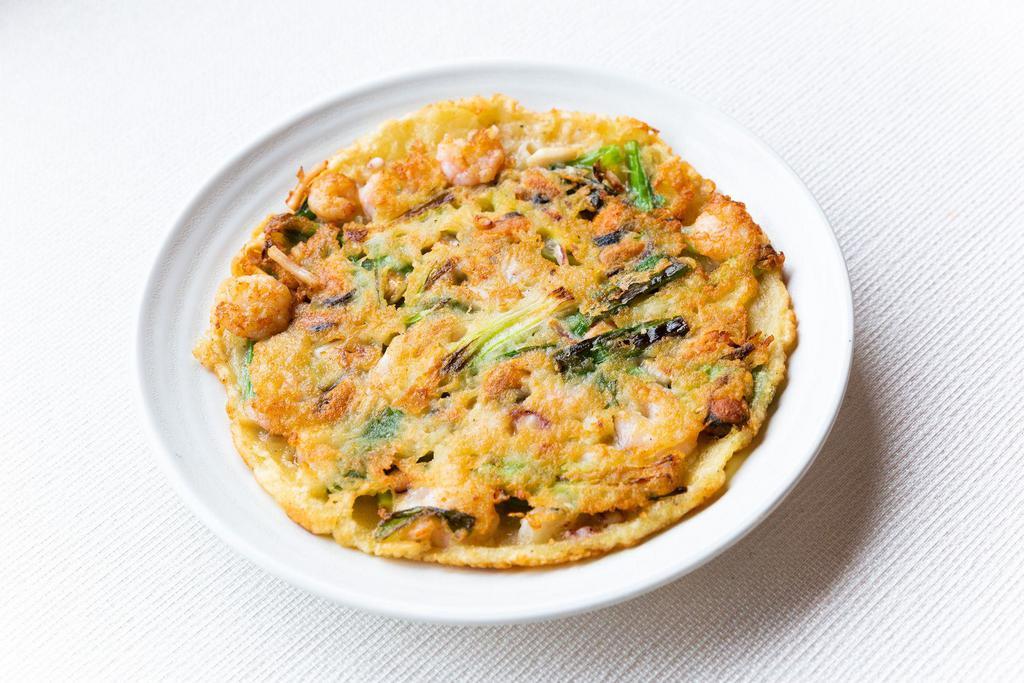 Haemul Pajeon · Korean style thin pancake w. assorted seafood, vegetables, and tofu.
