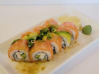 Salmon Yuzu Roll · California Roll topped with Salmon, Avocado, Green Onions, and Yuzu Sauce