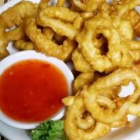 Calamari · Lightly battered and deep-fried squid rings accompanied with sweet chili sauce.