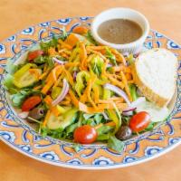 House Salad · Iceberg lettuce, tomatoes, green peppers, olives, carrots, banana peppers and onions.