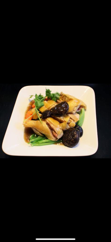 Com Ga Hap Cải Be Xanh An Nam · Chicken with mustard greens, shiitake mushrooms, & sauce over rice
