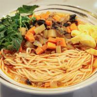 N4. Dun Huang Saozi Noodles · Hand-pulled noodles in house special sour-spicy soup topped with cilantro, potato, carrot, m...
