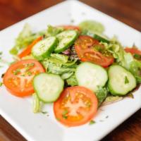 Mixed Green Salad · Mixed greens, sliced cucumbers, and tomatoes served with our amazing light garlic dressing.