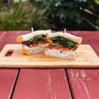 Chicken BLTDA Sandwich · Marinated chicken breast, crispy bacon, organic field greens, local dates, Granny Smith appl...