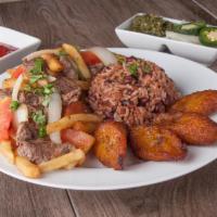 Lomo Saltado · Sauteed beef with tomatoes, onions, french fries and seasoned with soy sauce.