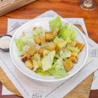 Caesar Salad · Traditional Caesar salad made with fresh romaine lettuce and aged Parmesan.