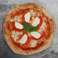 Caprese Pizza · Margherita with sliced tomatoes, fresh mozzarella, and extra basil.