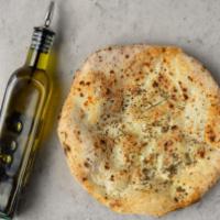 Focaccia Bread · Freshly baked focaccia bread with olive oil and Italian herbs.