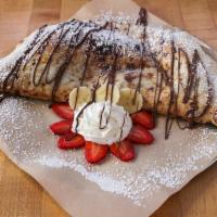 Nutella Calzone · Sweet pizza dough stuffed with Nutella and dusted with powdered sugar.