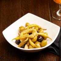 Aceitunas De La Casa Con Guindilla Vasca. · Marinated House Olives with Basque Peppers
