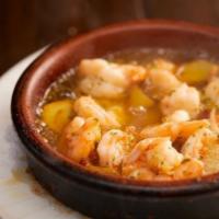 Gambas Al Ajillo. · Shrimp Sautéed in Garlic, Piri-Piri Peppers and
Olive Oil