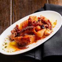Pulpo A La Plancha. · Seared Octopus with Potatoes and Smoked Paprika