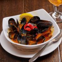 Mejillones Al Vapor. · Steamed Mussels in a White Wine and Saffron Broth