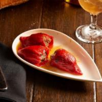 Pimientos Del Piquillo Rellenos. · Piquillo Peppers Stuffed with Braised Beef Short
Ribs and Served Au Jus