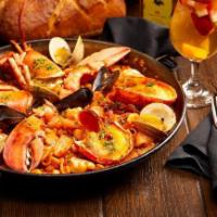 Marinera Con Bogavante Paella(Serves 2-3). · Seafood Paella with Monkfish, Clams,
Mussels, Squid, Scallops, Shrimp & Lobster