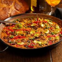 Vegetariana Paella. · Paella with Assorted Seasonal Vegetables