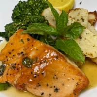 Salmon Piccata · Pan-seared filet of salmon sauteed in white wine, lemon butter sauce with capers, served wit...