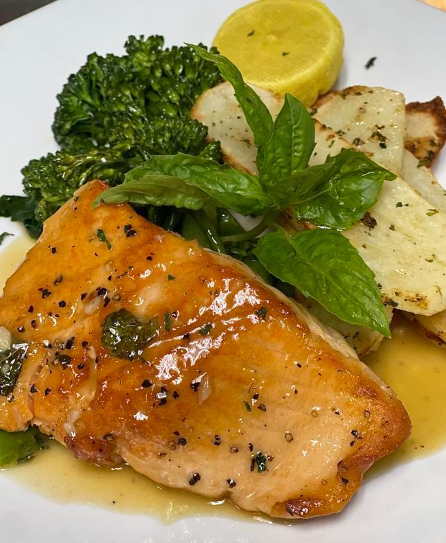 Salmon Piccata · Pan-seared filet of salmon sauteed in white wine, lemon butter sauce with capers, served with Broccolini and Tuscan potatoes.