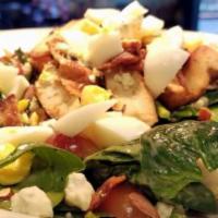 Moo's Farm Spinach Salad · Fresh spinach, poppy seed dressing, grilled chicken breast, crumbled blue cheese, bacon, gra...