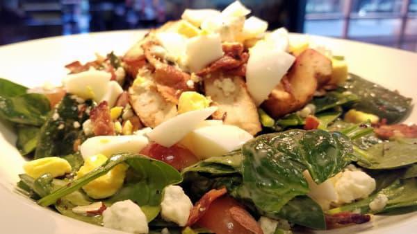 Moo's Farm Spinach Salad · Fresh spinach, poppy seed dressing, grilled chicken breast, crumbled blue cheese, bacon, grapes, almonds and hard boiled egg.