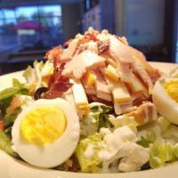 Chef Salad · Romaine, tomato, olives, onions, croutons, ham, turkey, American and Swiss cheese, boiled eg...