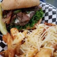 Philly Cheese Moo Burger · On a kaiser bun, with mayonnaise, lettuce and tomato, topped with Swiss cheese, a Philly mix...